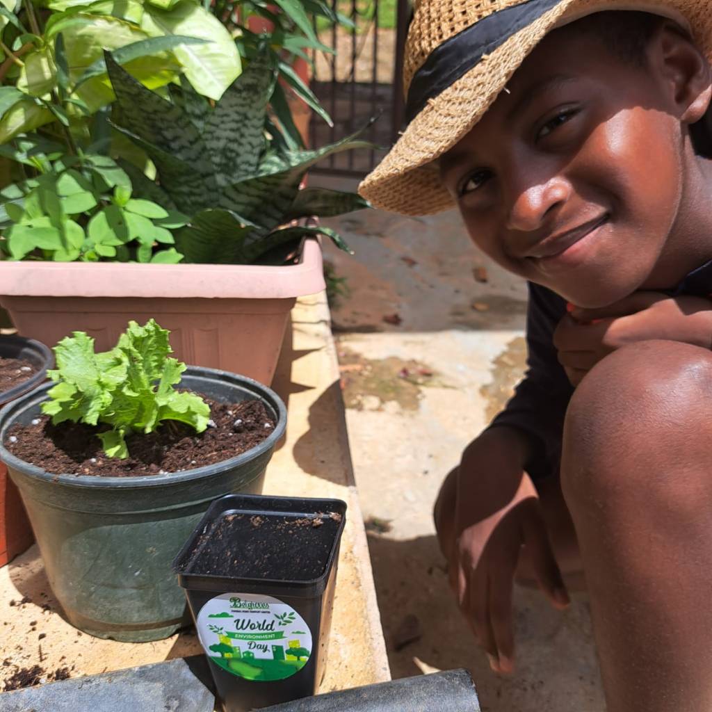 A young child planting crops distributed by Belgroves Funeral Home